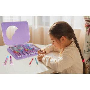 caucasian child girl painting with colored pencils and making cr