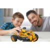 little boy and father playing with car on table at home