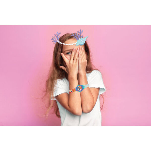 cute kid looking through her fingers while closing her face