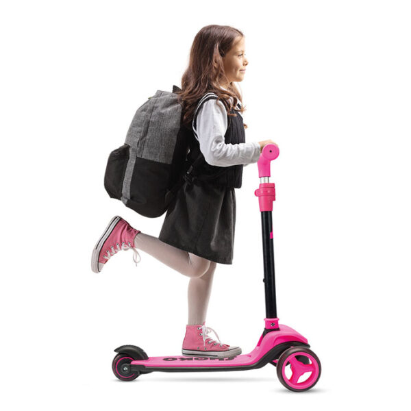 schoolgirl with a backpack riding a scooter